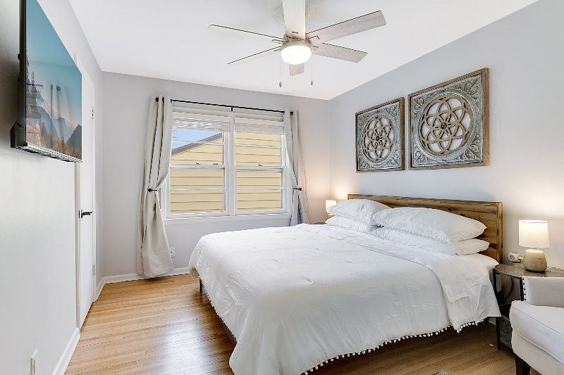 Main floor bedroom 2 - Main floor bedroom 1 - Large and bright with a KING-sized bed, sitting chair, smart TV and large closet with organizer for all of your things. Window blinds and BLACK OUT curtains for sleeping!