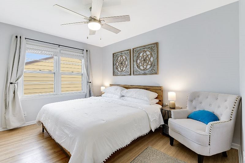 Main floor bedroom 2 - King bed, large clean and fresh closet with organizer system plus lots of hangers and baskets for all of your storage needs