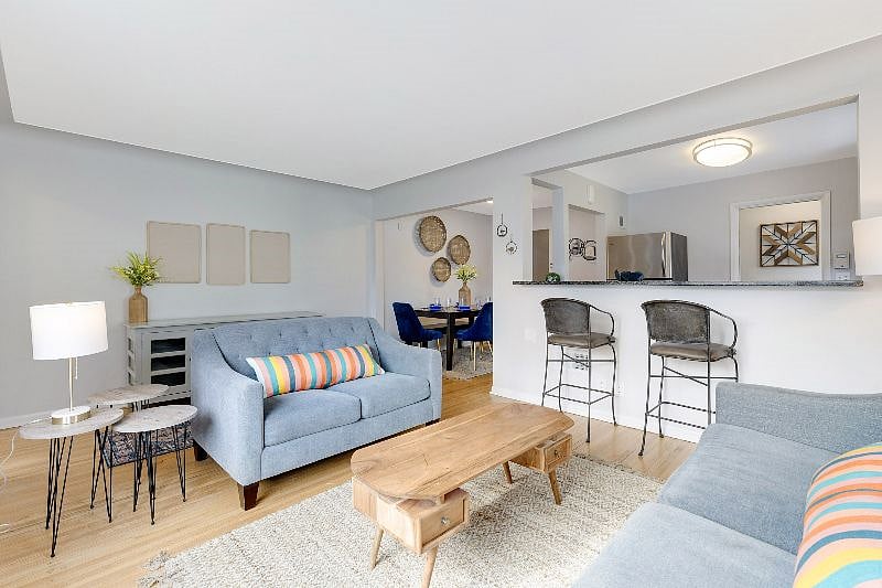 Bright and modern open concept living room, dining room and kitchen