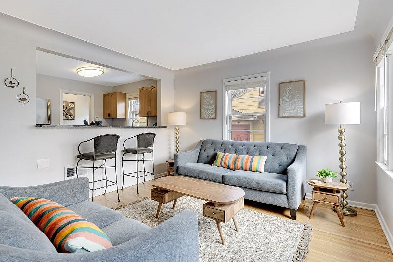 Bright and modern open concept living room, dining room and kitchen