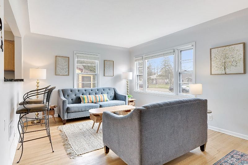 Bright and modern open concept living room, dining room and kitchen