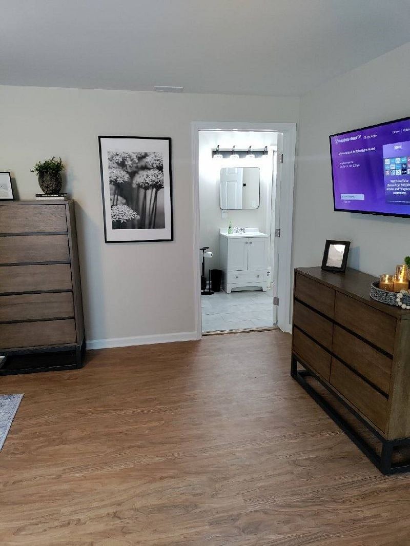 Access from bedroom to bathroom as well as bathroom to kitchen and dining space.