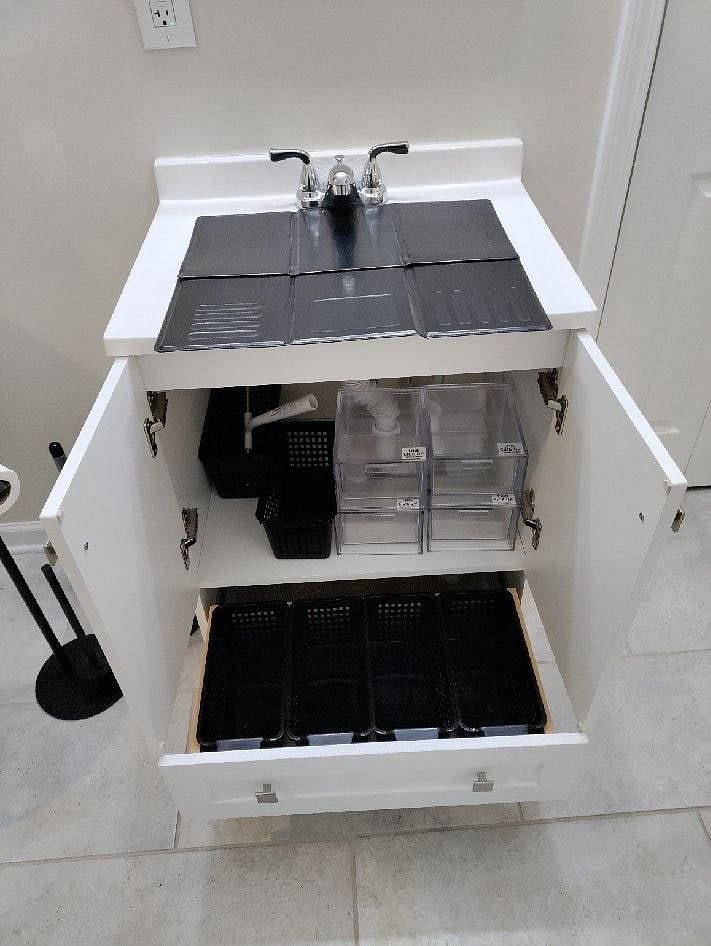 Cover sink to provide additional counter space in bathroom