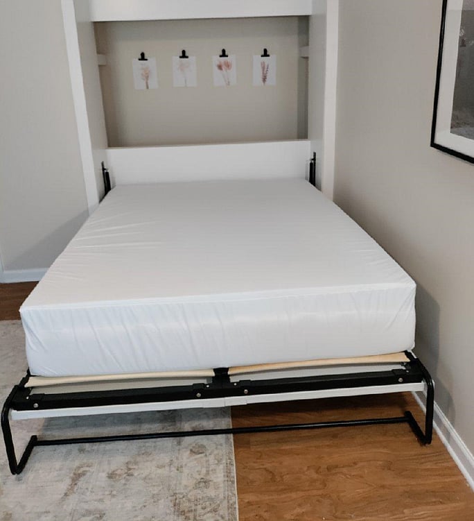 Queen size murphy bed in living room with 3 inch gel foam mattress topper.