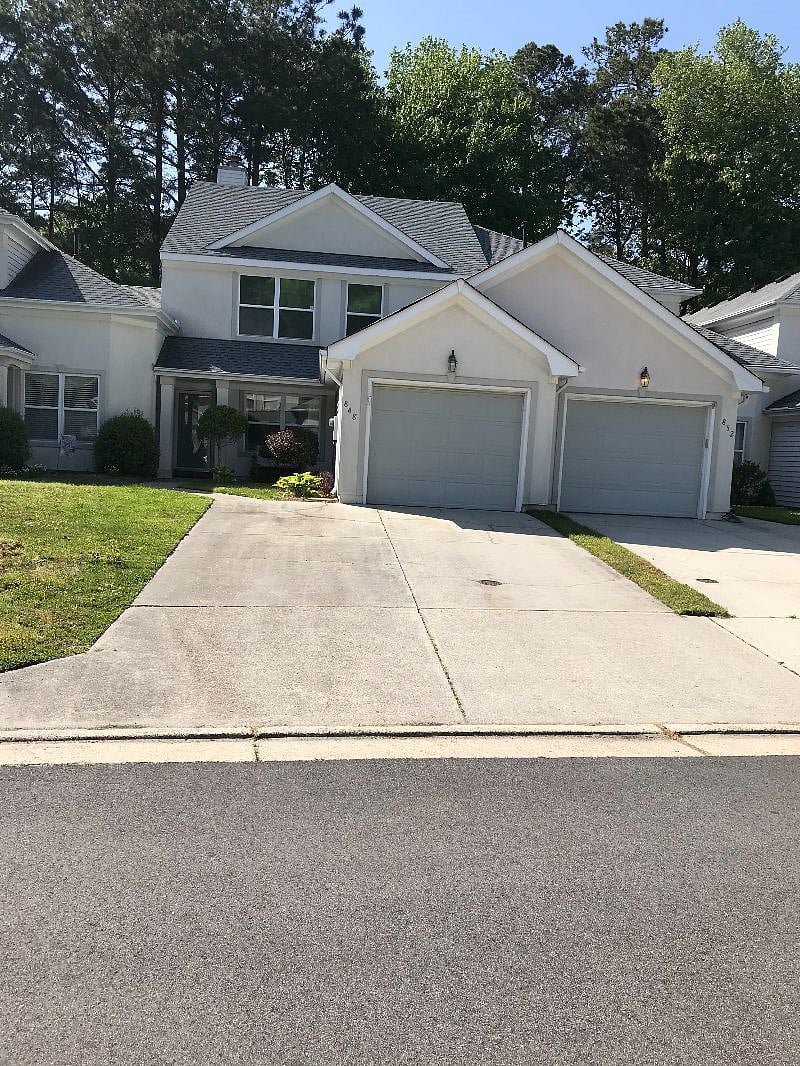 Street view of house; your reserved parking space is on the left.