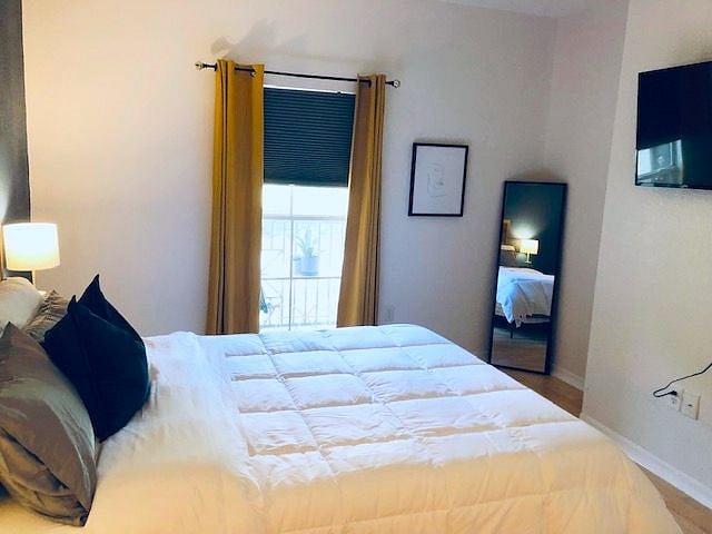 Cheery by day and the right curtains (blackout) blinds to help you rest well at "night". lamps with USB ports, remote control light/fan, 43" Roku tv ready to stream, and a super comfy bed.