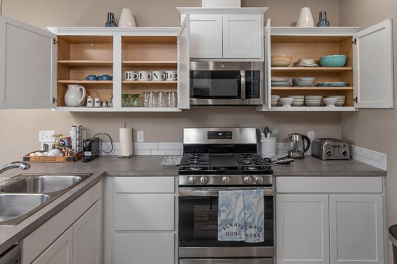 Enjoy a Pottery Barn & Crate and Barrel stocked kitchen.