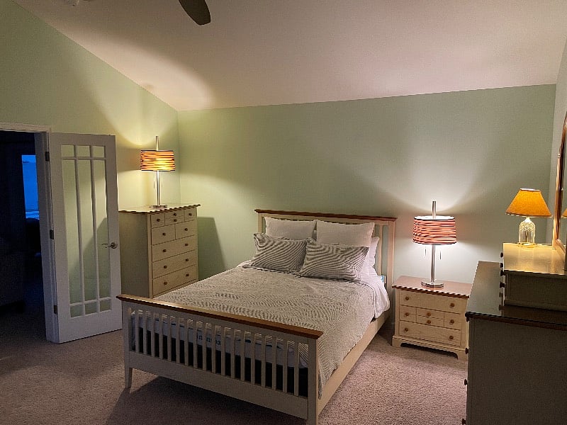 Bedroom with vaulted ceilings and ceiling fan with separate HVAC.