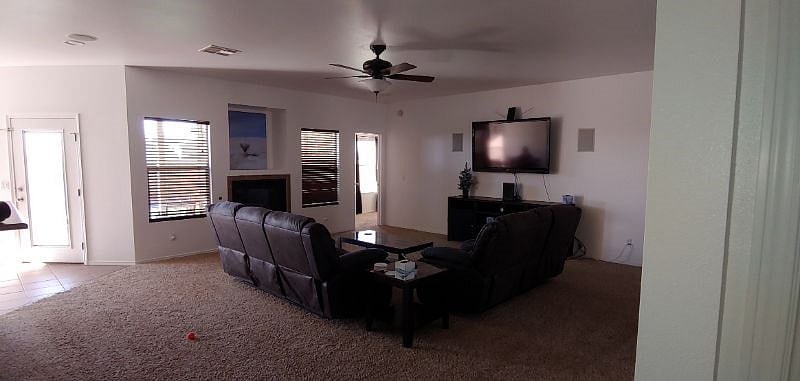 Living room. 65 inch TV, built in speakers and a blue tooth receiver.
