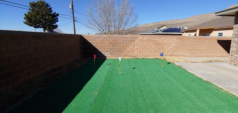 Turf backyard with putting green