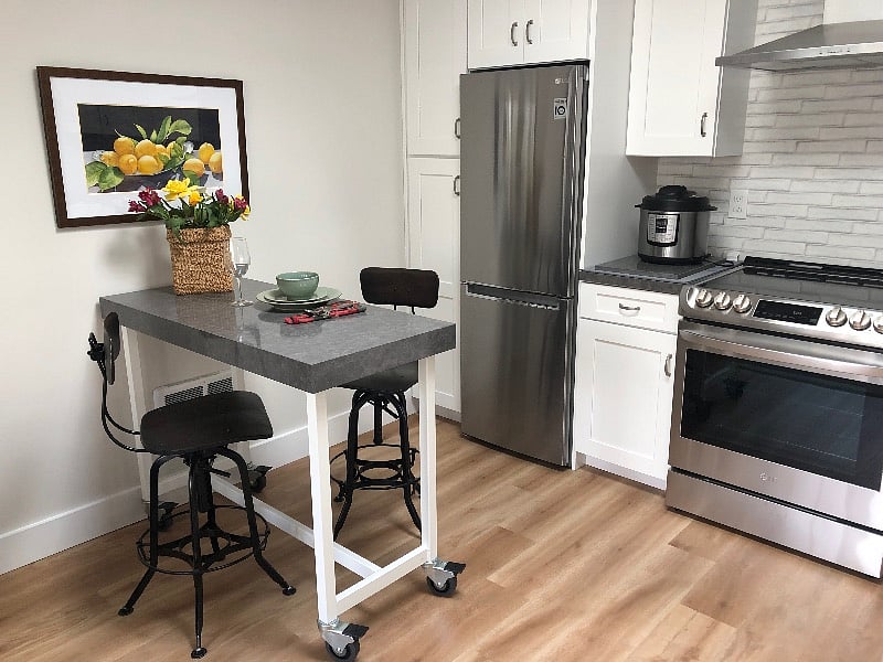 versatile quartz counter island with wheels for meal prep, dining, or as a work station
