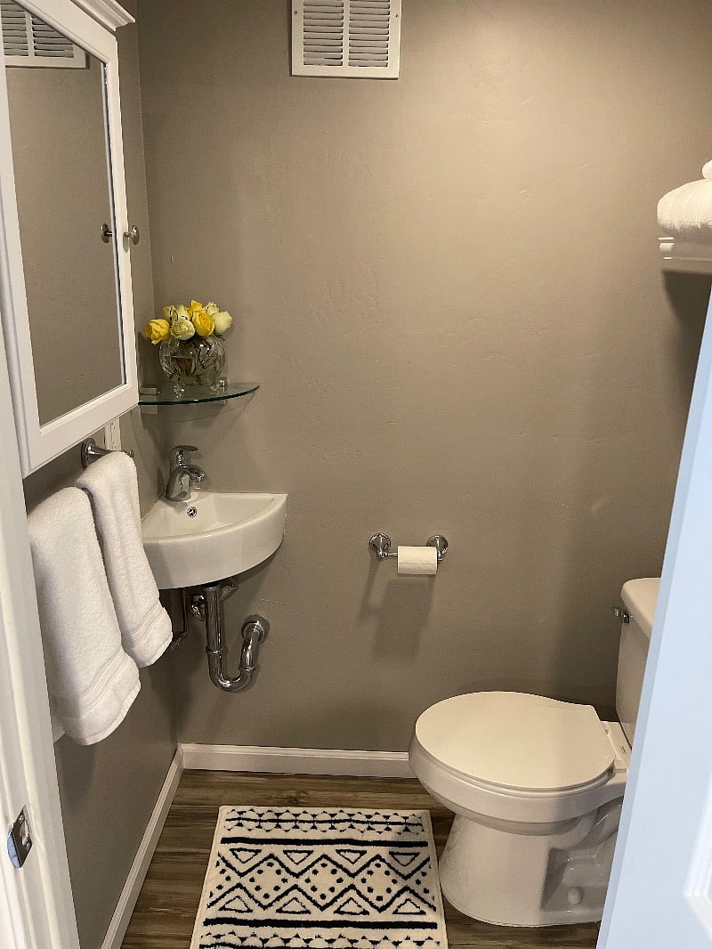 This quarter bath is located downstairs for you comfort and ease no going up and down the stairs.