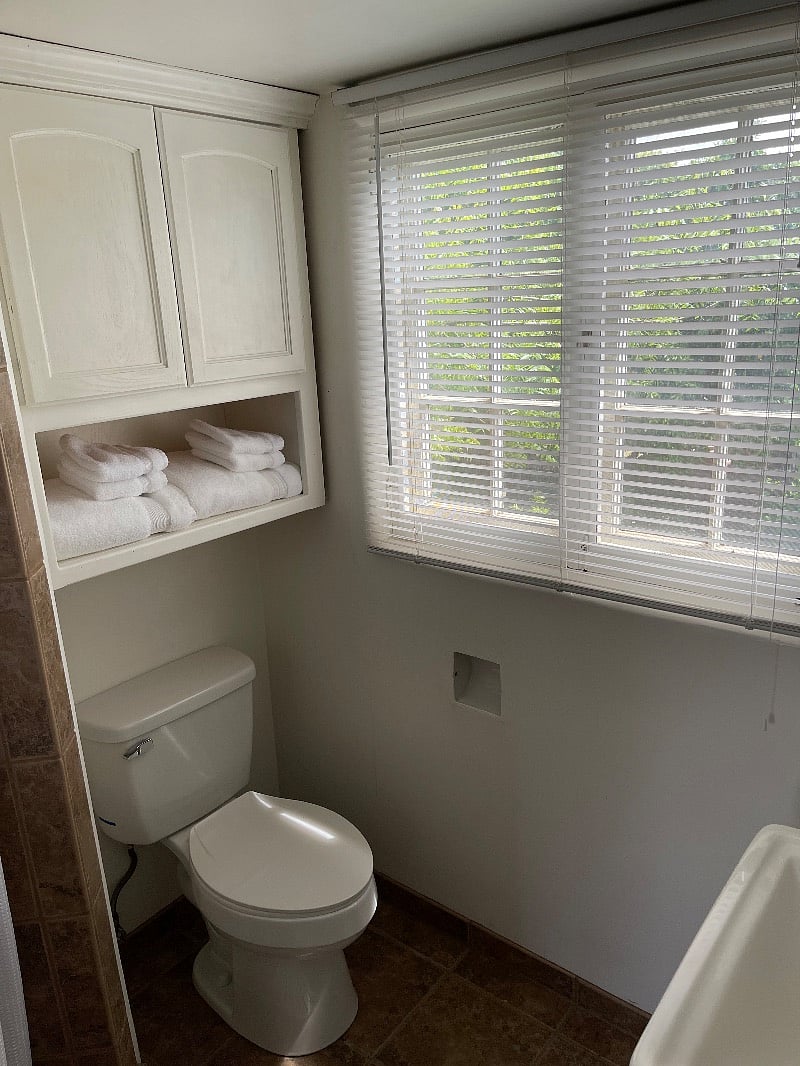 Storage for your traveling need above the toilet. We clean and sanitize everything before your stay.