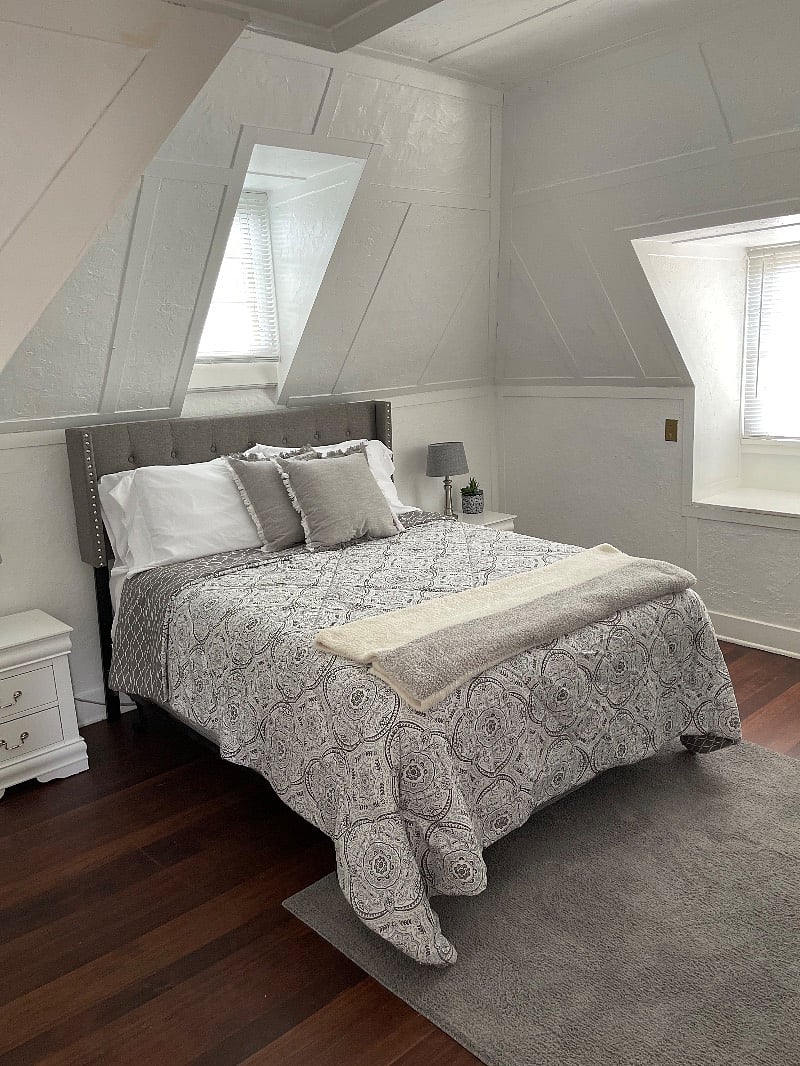 Clean, cotton sheets on this amazingly comfortable queen size bed. Weve had many complements on how winder this bed is. Lighting and storage in these nightstands. There is a small closet located in the bedroom to hang clothes and lay shoes.