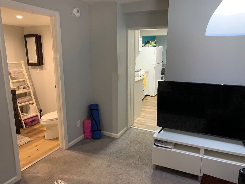 Smart 48" TV with full bath looking into kitchen