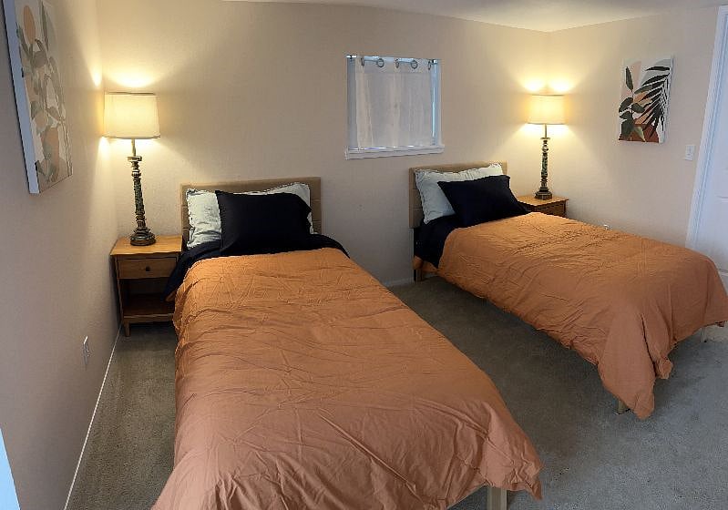 Alternate bedroom configuration as two XL twins instead of king bed.