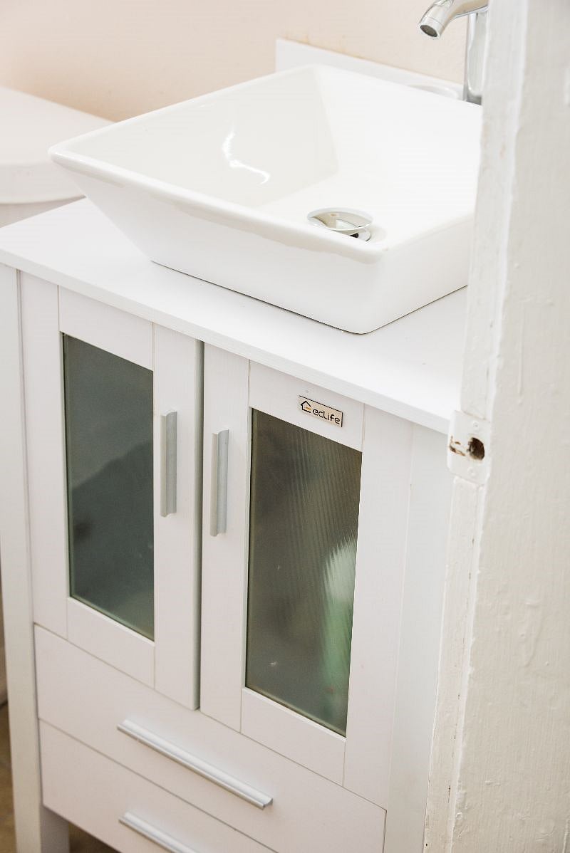 Lots of free storage in Vanity cabinets along Hair Dryer.