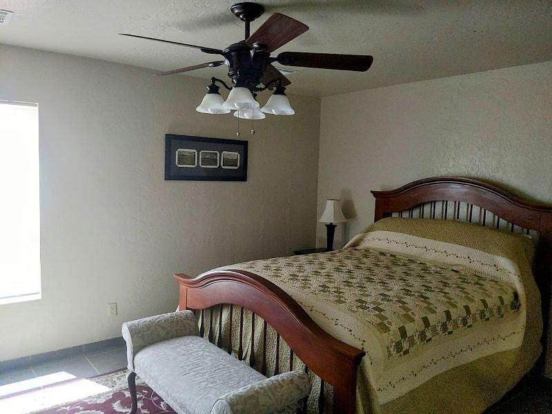 Basset furniture queen bedding overhead fan.