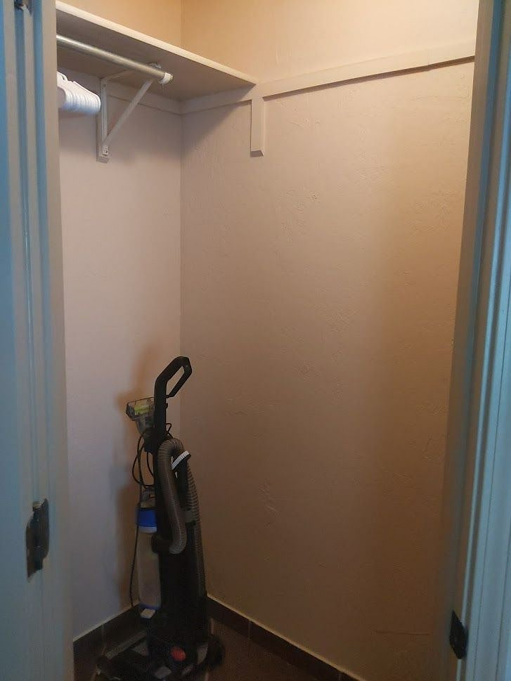 closet holding vacuum cleaner, broom, mop and bucket or your extra room for storage