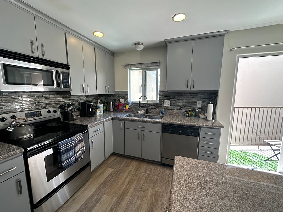 Fully stocked kitchen with dishwasher, oven, stove, and microwave