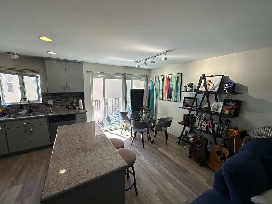 Glass dining table included, and island is great for entertaining dinner guest