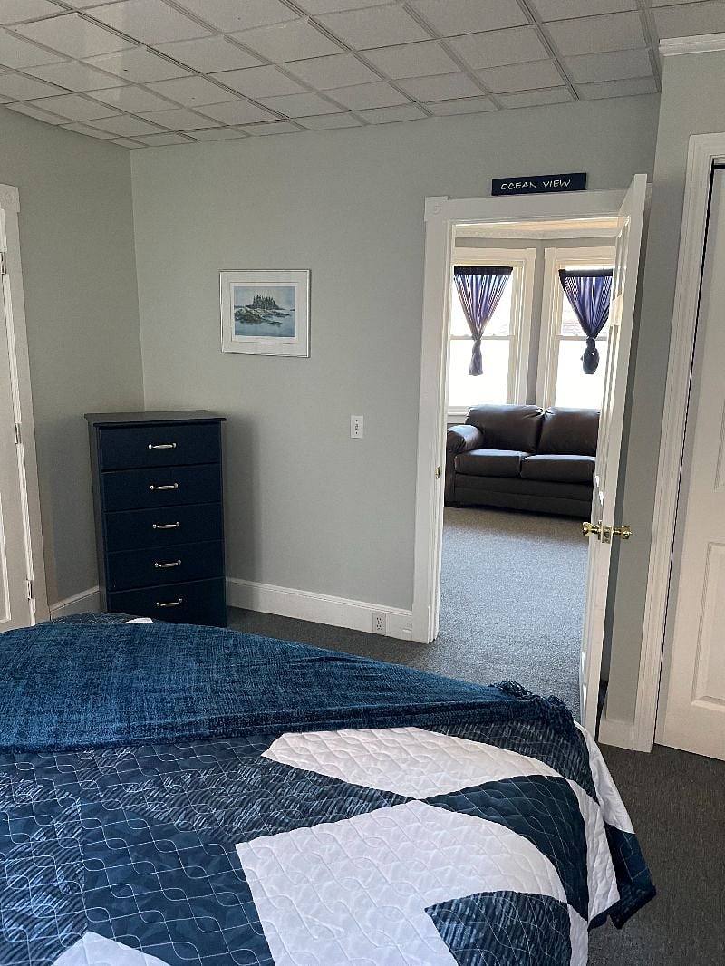 Looking out of bedroom #1 into living room. Both of these rooms have carpet.