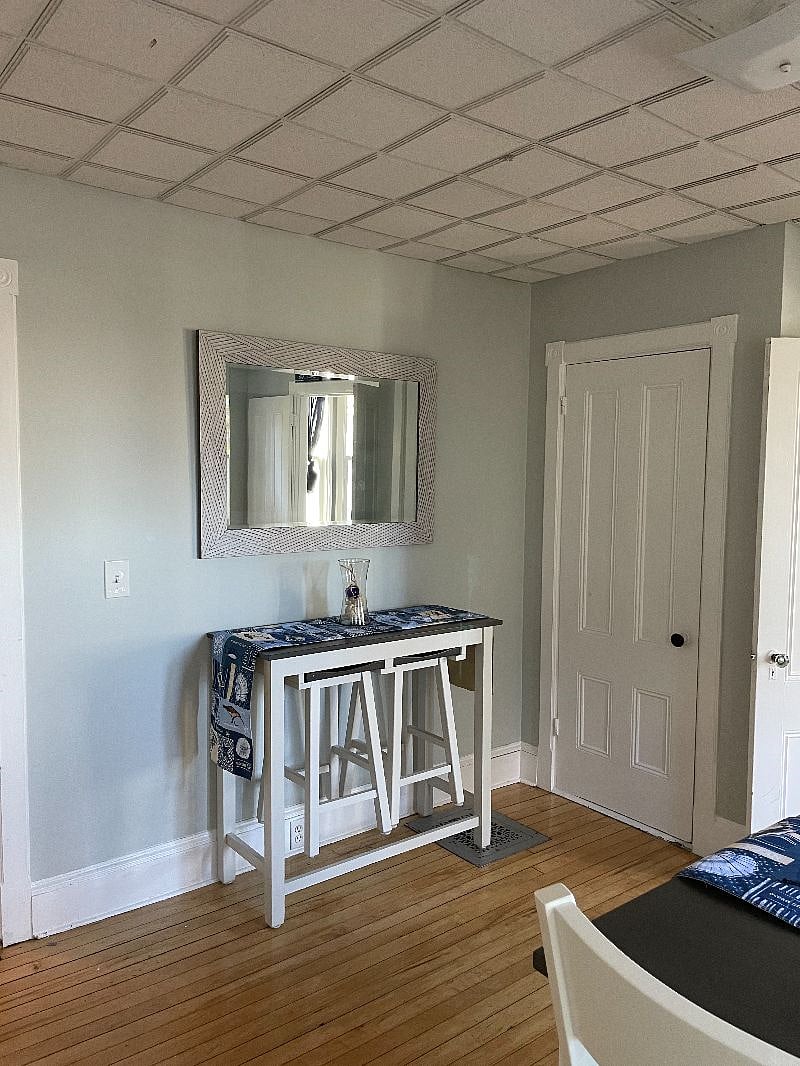 Counter height side table with two stools.Nice work table.