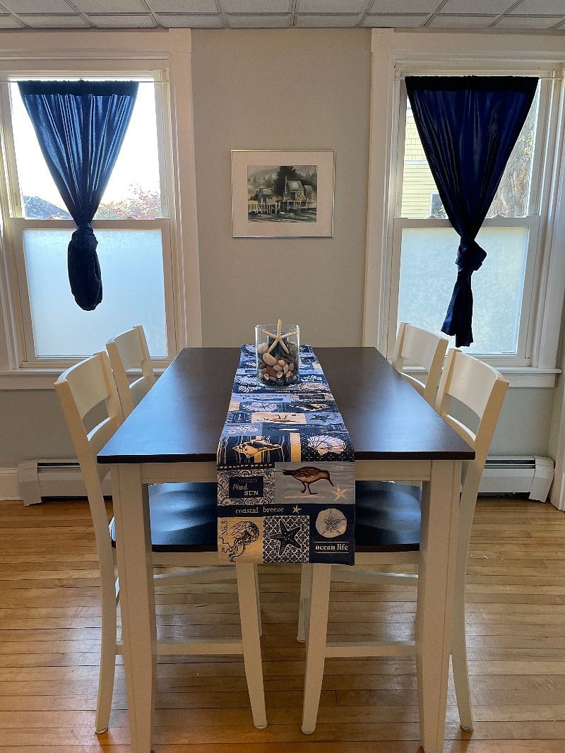 Counter height dining room set. Tinted windows with black out curtains.