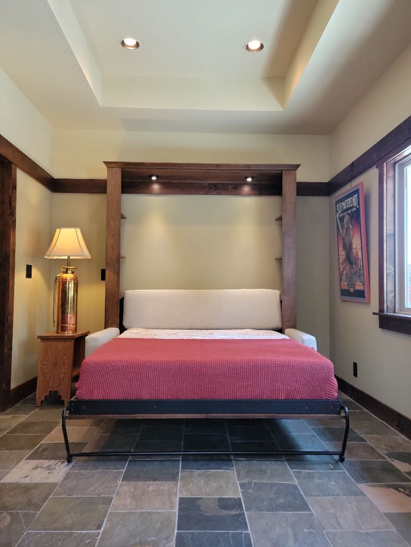When it is time to go to bed, the couch easily transforms by pulling the 15" Serta Dream mattress down from the wall.