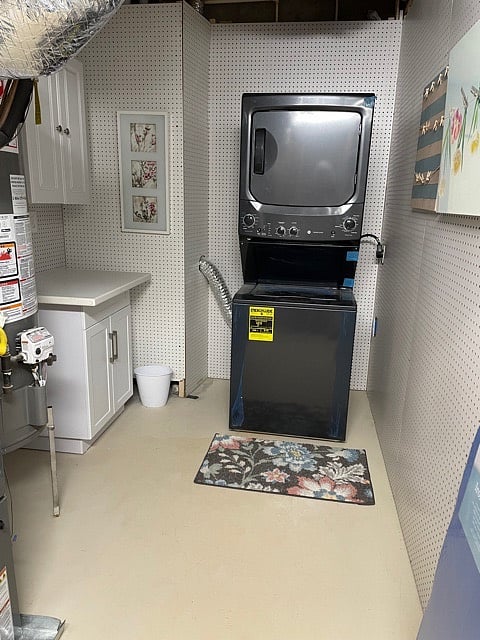 Brand-new stacked washer/dryer in the laundry room