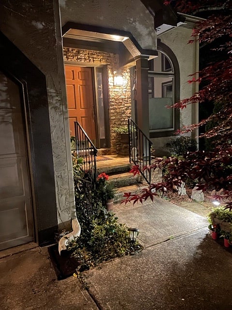 Every exterior door has its own light and deadbolt lock. This is the front door of the main house at night.