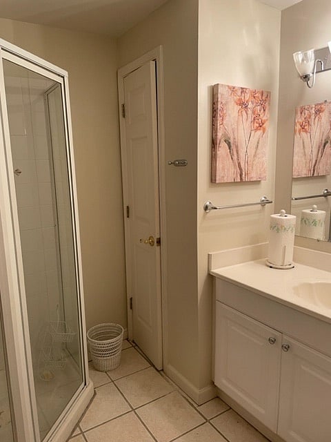 The large bath has plenty of storage and good lighting too.