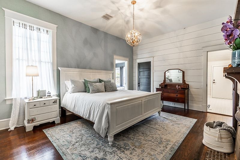 The second bedroom has King bed, nightstand, dresser and lamp.