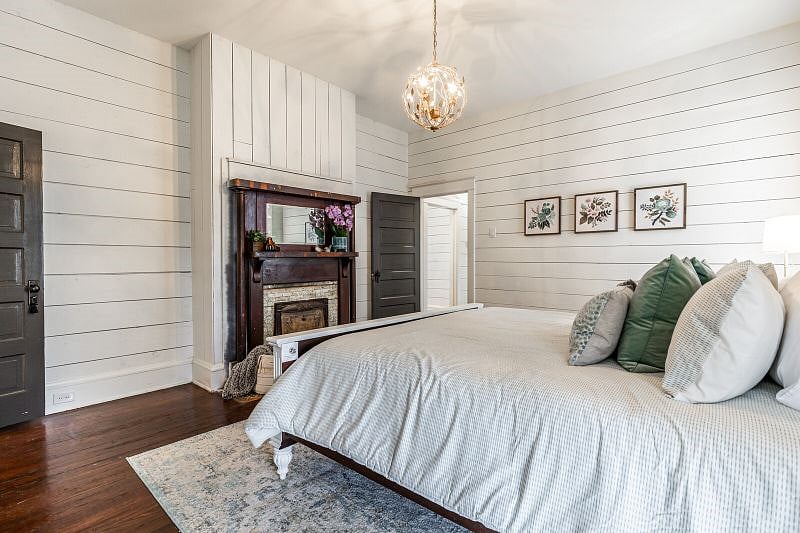While the house contains two original fireplaces they are non working fireplaces. But don't worry it has a brand new AC and heater!