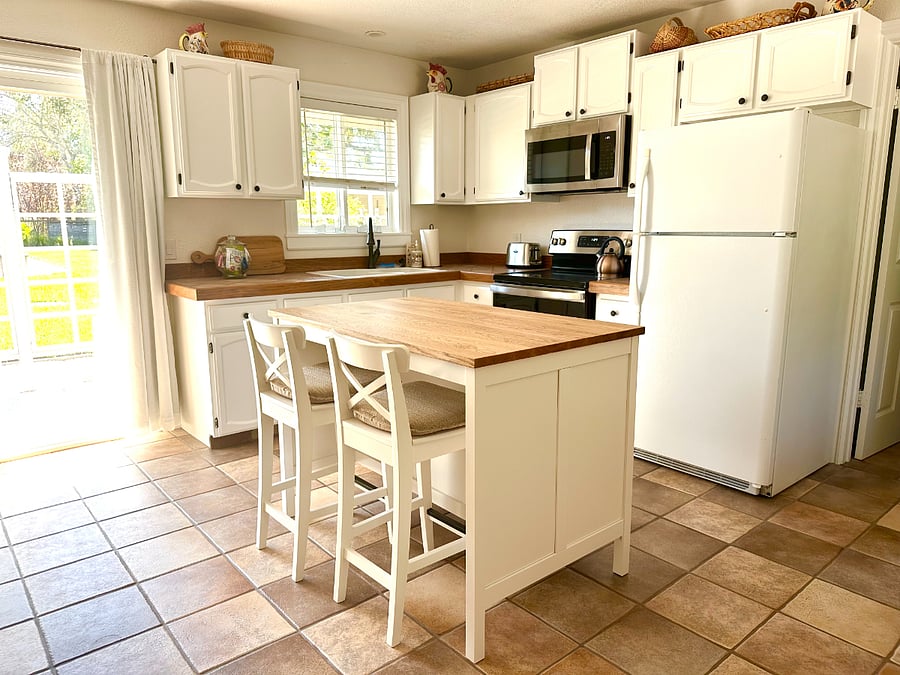 Spacious kitchen with new appliances and kitchen island