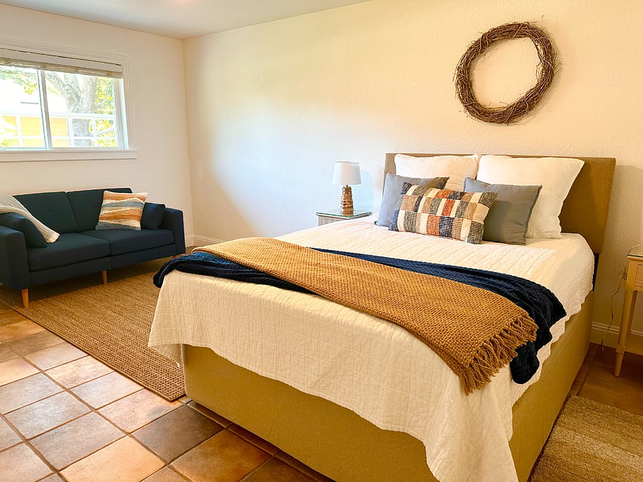 Large bedroom has sitting area and open space that's great for yoga or stretching exercises