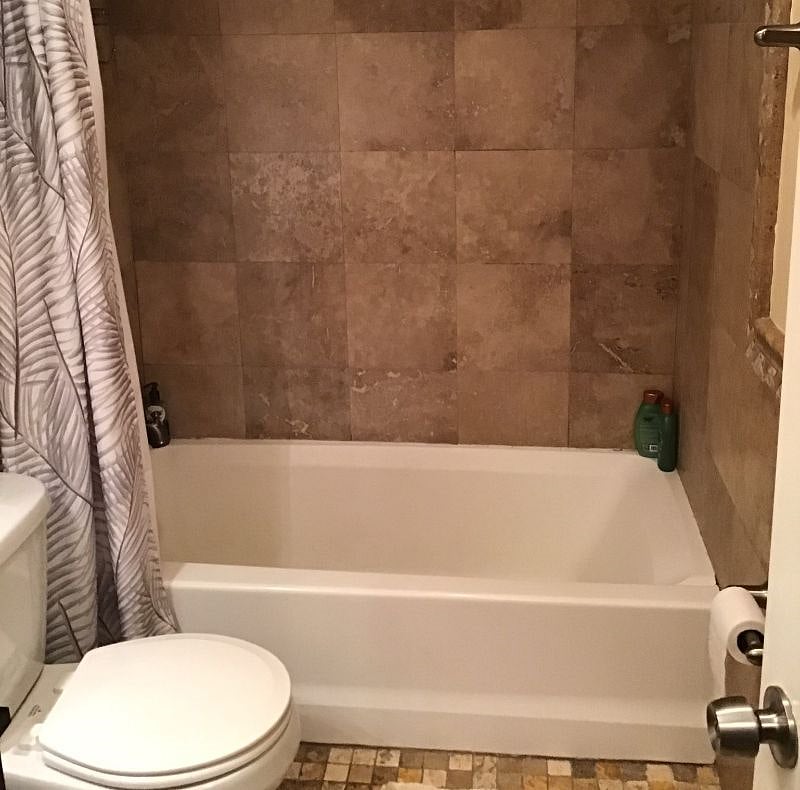 Second bathroom with tub shower