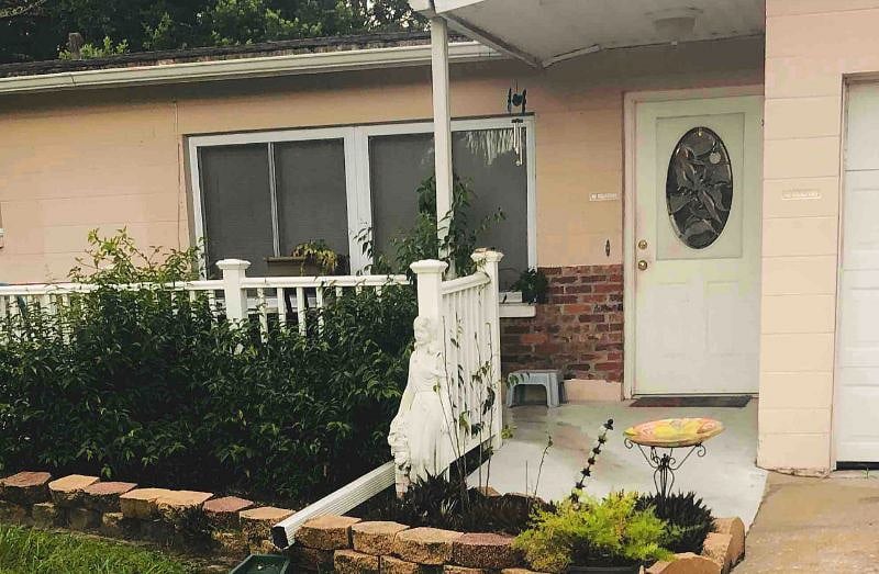 front door with porch amd ramp to assist with luggage