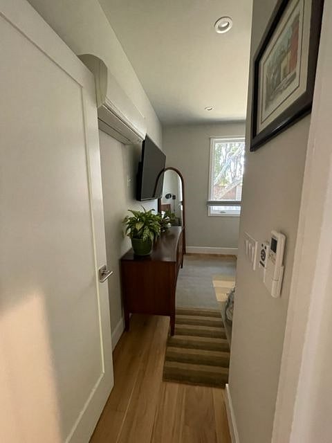 Hall way into bedroom, with bathroom door to the right.