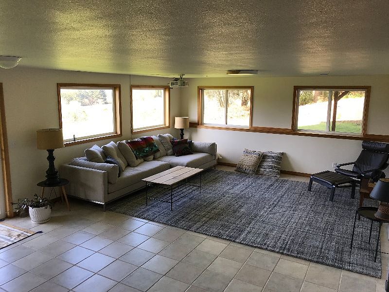 Basement movie room. Small wet bar to the left, patio off the back. Hot Tub.