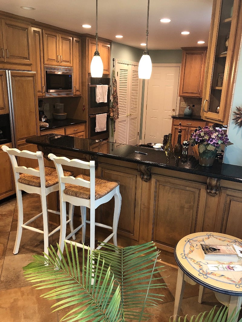 Bar stools and fully equipped kitchen for your use. Cooktop, microwave, double ovens, frig. Washer/dryer behind louvered doors.