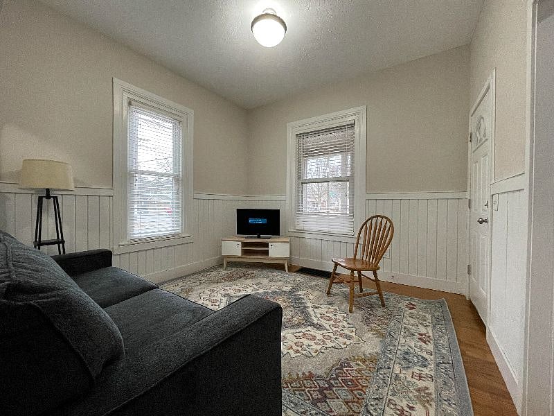 Living room with access to front screened in porch