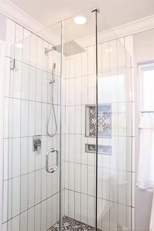 The shower in the master bathroom (complete with a variety of soaps, as well as supplied shampoos) features an adjustable hand wand alongside a waterfall shower head.