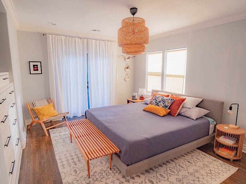 The master bedroom with a connected private bath room, as well as french doors that open out to the backyard.
Update: The windows have a removable blackout covering and the french doors have a soft blackout curtain).