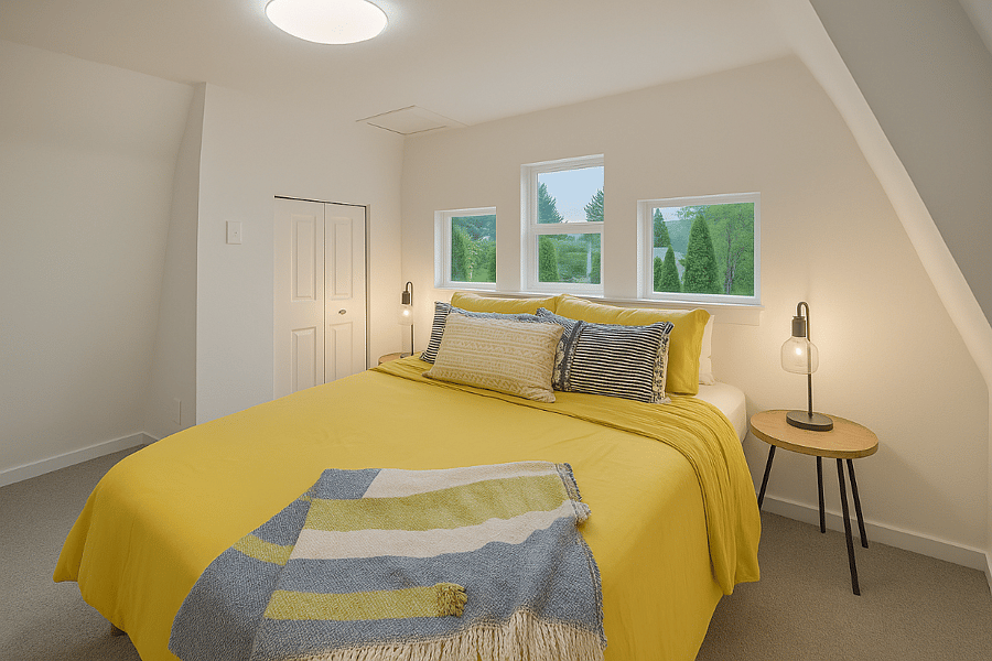 Bright and inviting, this bedroom features a plush queen mattress perfect for a restful night