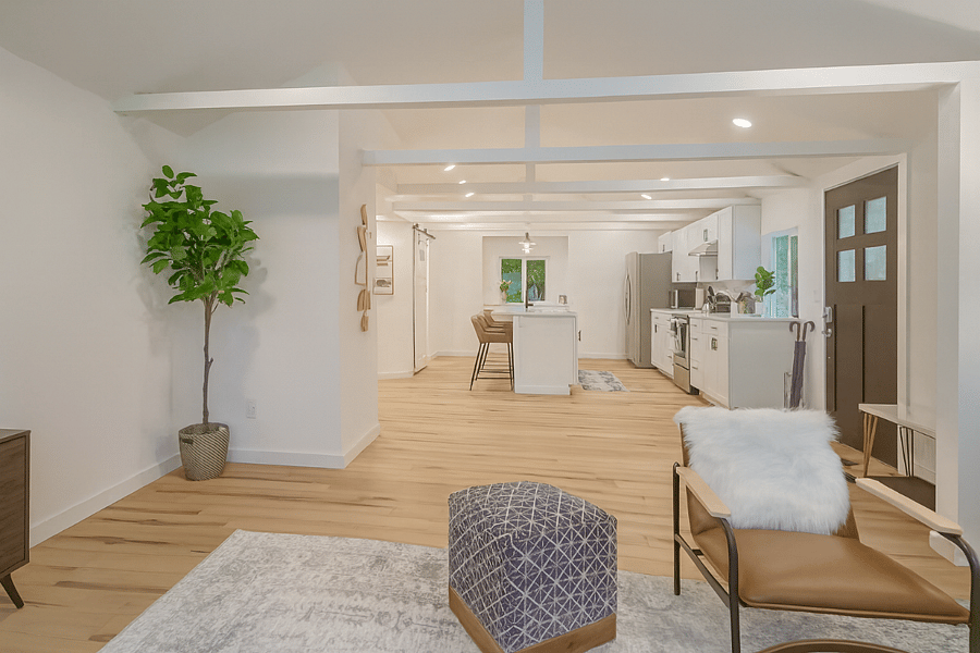 Bright, open-concept layout connects the living room seamlessly to the fully equipped kitchenperfect for cooking, entertaining, or just relaxing at home