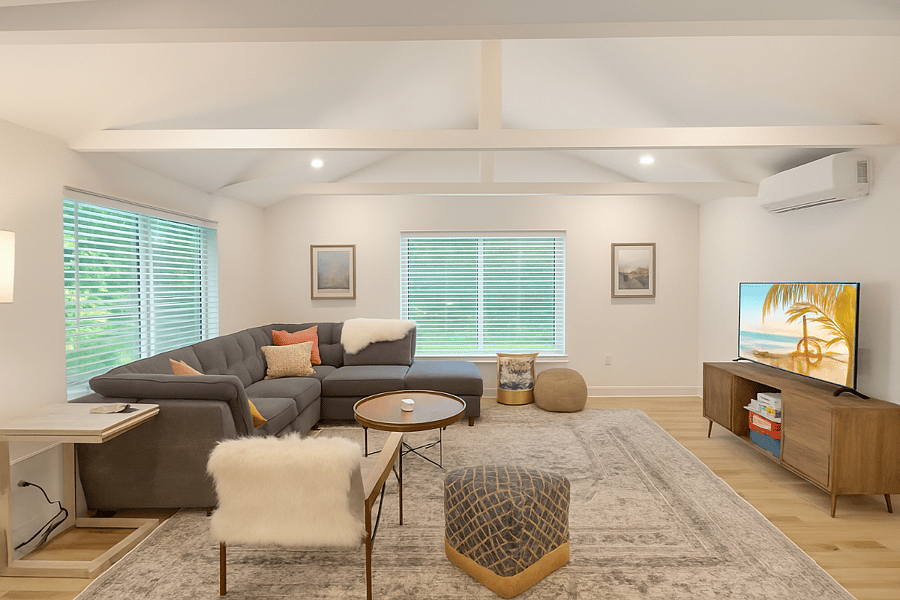 Unwind in the inviting living room, complete with a large sectional, calming neutral tones, and a smart TVperfect for a cozy movie night or slow morning