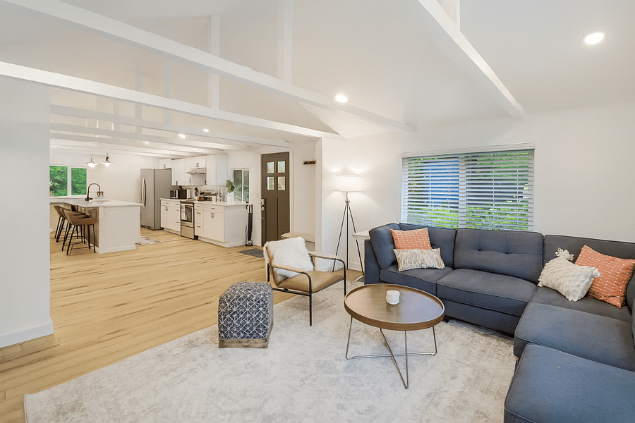 Bright and open-concept living area with vaulted ceilings and modern touches