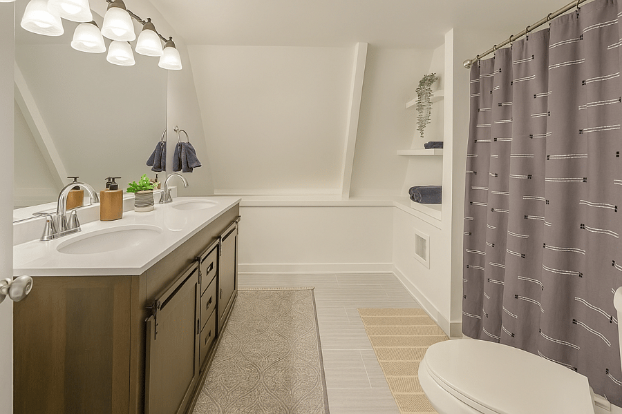 Spacious full bath with double vanity, built-in shelving, and modern lightingperfect for getting ready with ease.