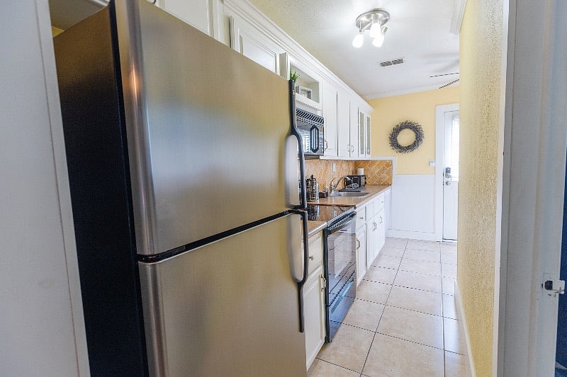 View back down galley kitchen towards entrance.